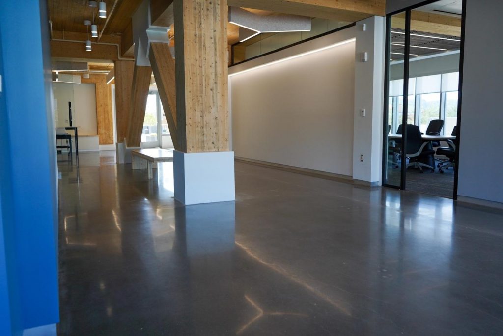 A polished, slightly reflective floor in an office space.