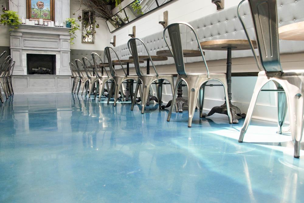 A turquoise-colored polished concrete floor.