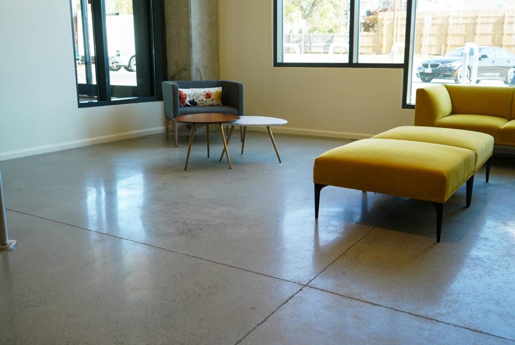 A polished concrete floor in an office waiting area.