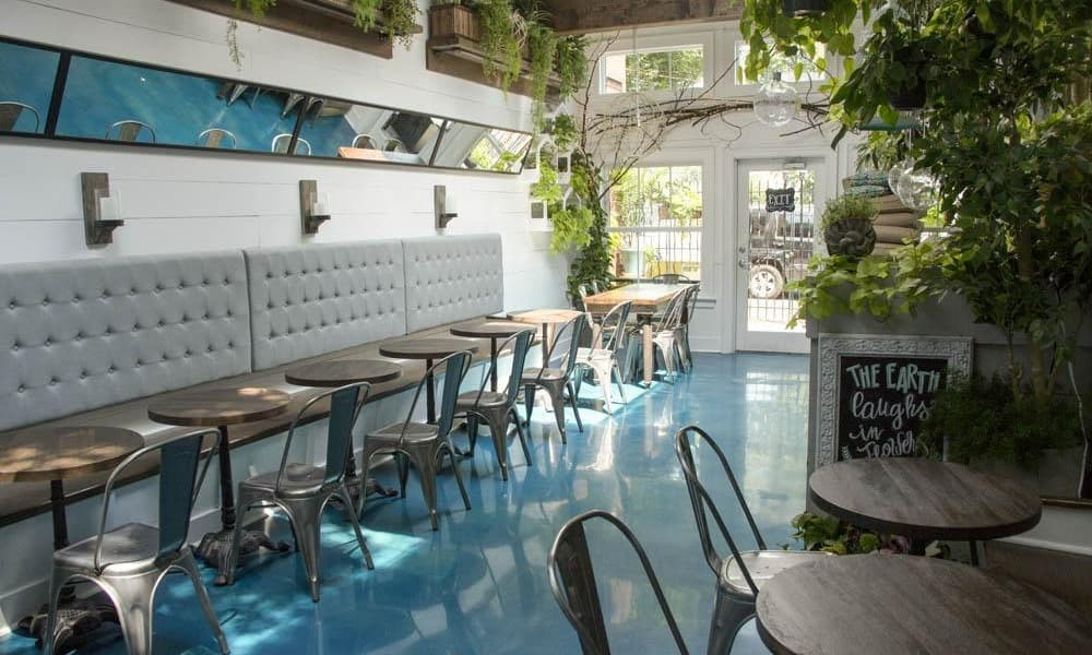 A highly polished, colored concrete floor in a restaurant.