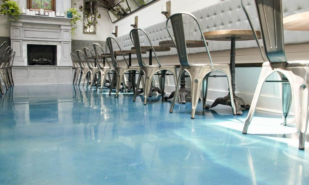 A polished concrete floor worked on by a hydroblast technician.