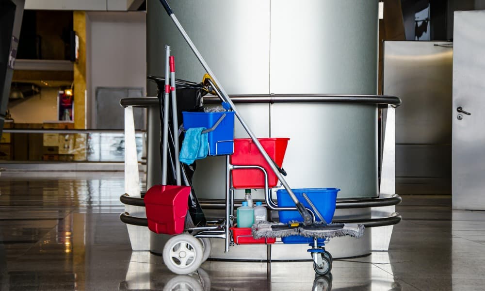 A mobile cart with products for cleaning polished concrete.