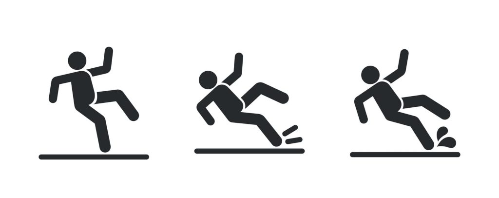 A representation of a slip-and-fall accident due to lack of traction in concrete.