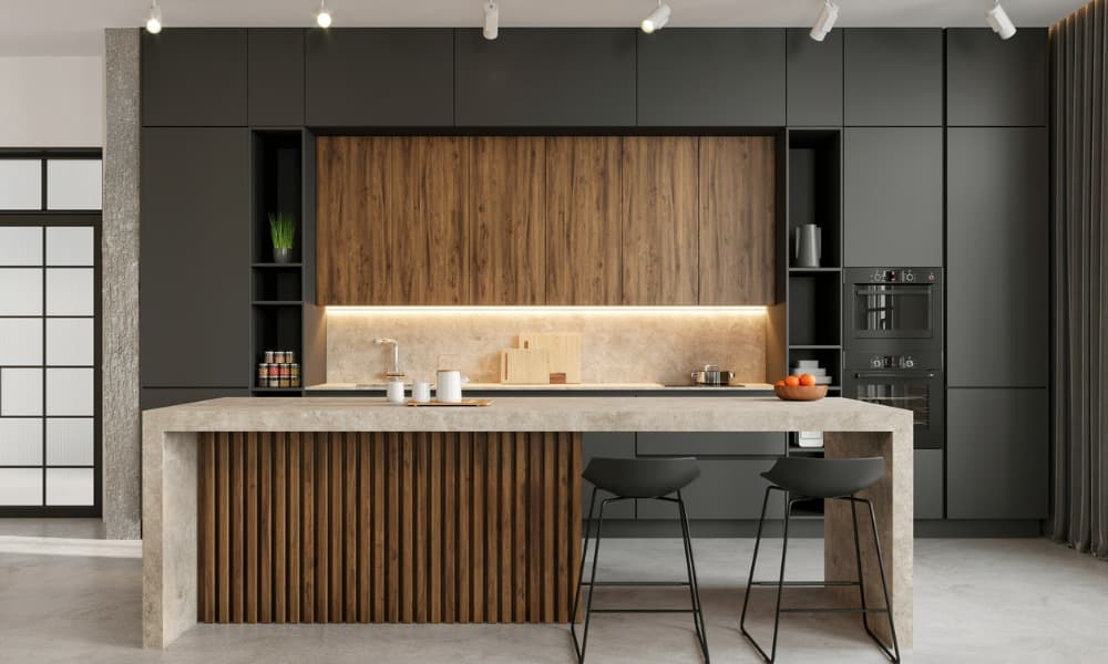A modern kitchen with low-shine concrete flooring depicting concrete ideas for the kitchen. 