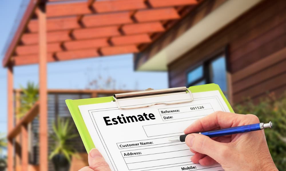 A contractor preparing written estimates for polishing projects.
